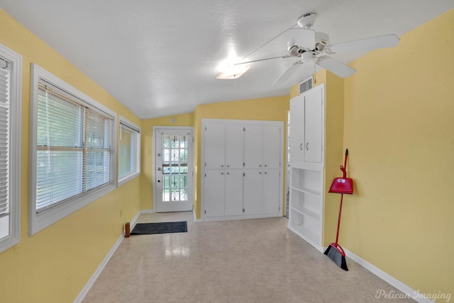 651 Delaware St, Shreveport, LA 71106 - foyer entrance with a ceiling fan, baseboards, vaulted ceiling, and visible vents