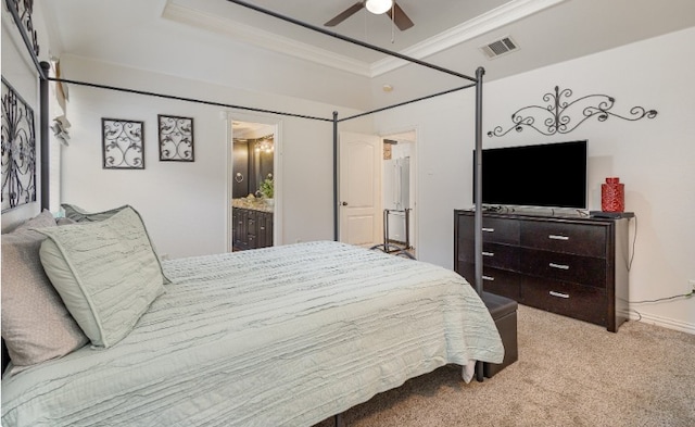 bedroom with ornamental molding, ensuite bath, carpet floors, visible vents, and ceiling fan