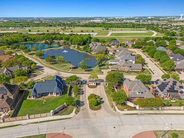 birds eye view of property featuring a residential view and a water view