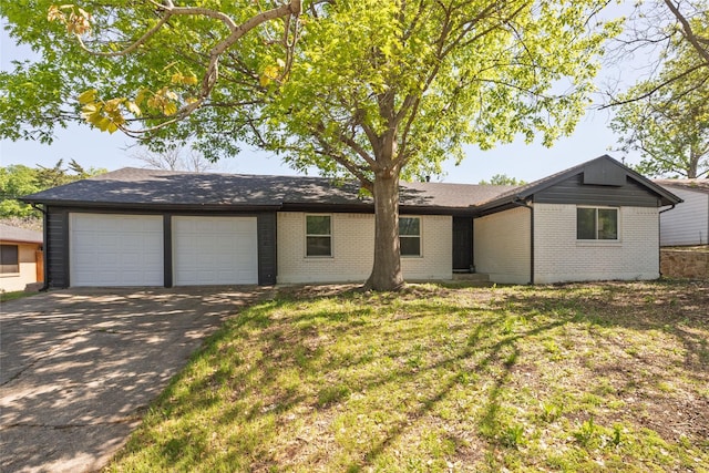 single story home featuring brick siding, an attached garage, driveway, and roof with shingles