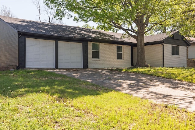 ranch-style house with an attached garage, roof with shingles, driveway, and brick siding