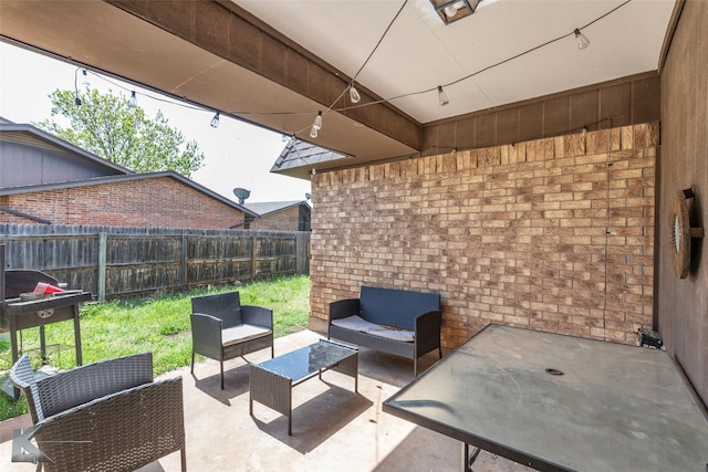 view of patio with outdoor lounge area and fence