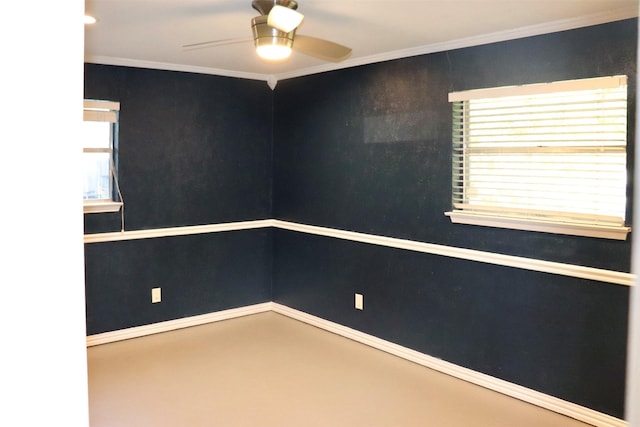 empty room with ornamental molding and ceiling fan