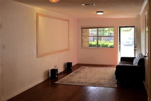interior space with visible vents, crown molding, dark wood finished floors, and baseboards