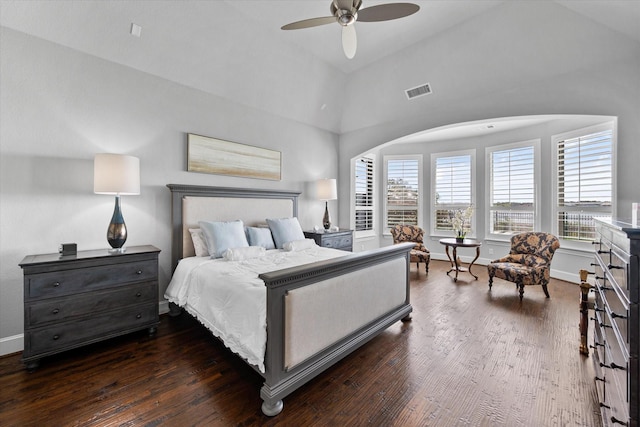 bedroom with dark wood finished floors, multiple windows, and visible vents