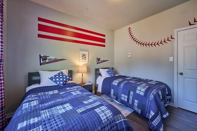 bedroom with wood finished floors