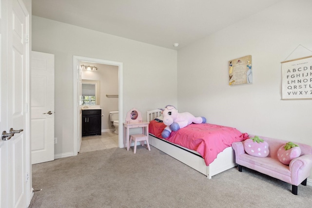 4538 Cherbourg St, Dallas, TX 75216 - carpeted bedroom with connected bathroom and baseboards