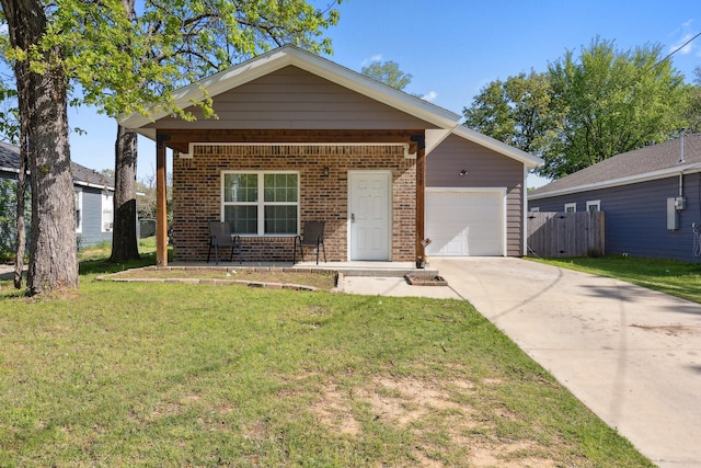 4538 Cherbourg St, Dallas, TX 75216 - view of front of home with brick siding, driveway, a garage, and covered porch
