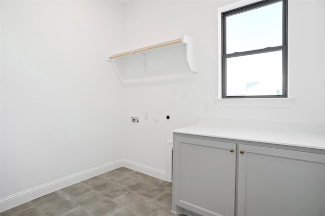 laundry room featuring cabinet space, baseboards, electric dryer hookup, and hookup for a washing machine