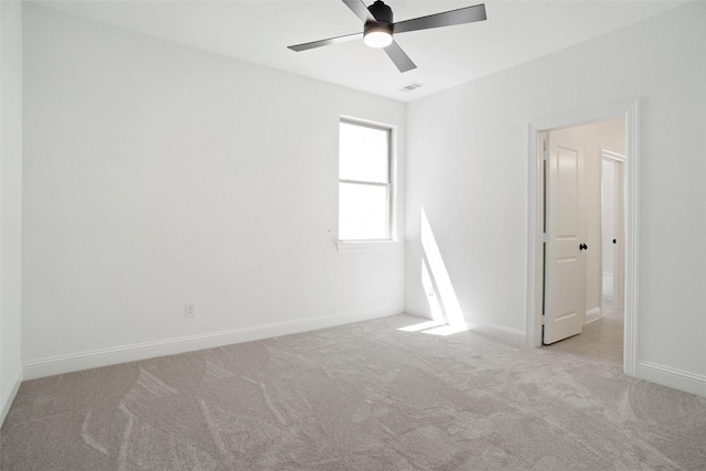 unfurnished bedroom featuring visible vents, ceiling fan, baseboards, and carpet
