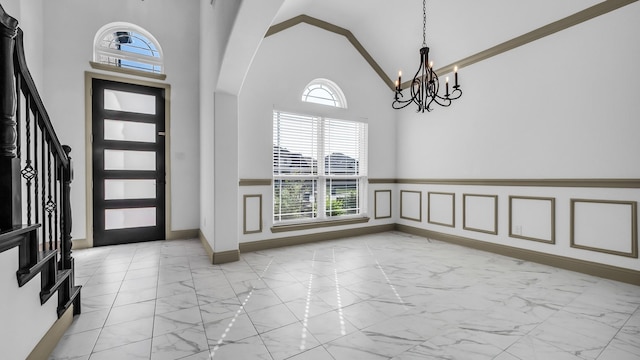304 Winding Creek Ln, Anna, TX 75409 - foyer entrance with a notable chandelier, stairway, high vaulted ceiling, arched walkways, and marble finish floor