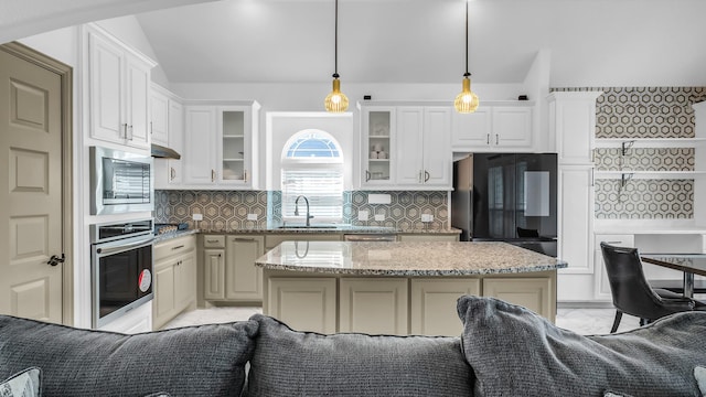304 Winding Creek Ln, Anna, TX 75409 - kitchen with glass insert cabinets, vaulted ceiling, appliances with stainless steel finishes, marble finish floor, and a sink