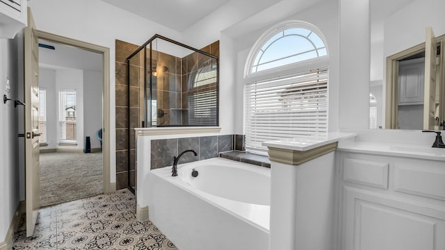 304 Winding Creek Ln, Anna, TX 75409 - full bathroom with tile patterned floors, a shower stall, vanity, and a garden tub