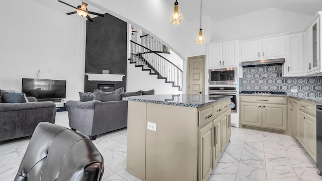 304 Winding Creek Ln, Anna, TX 75409 - kitchen with open floor plan, a ceiling fan, backsplash, stainless steel appliances, and marble finish floor