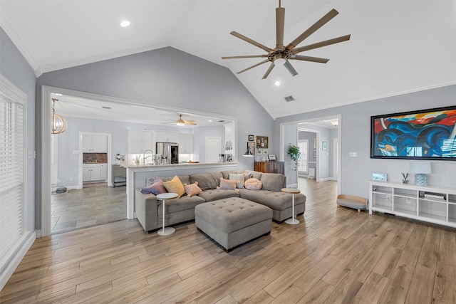 living area with recessed lighting, a ceiling fan, visible vents, and light wood-style flooring