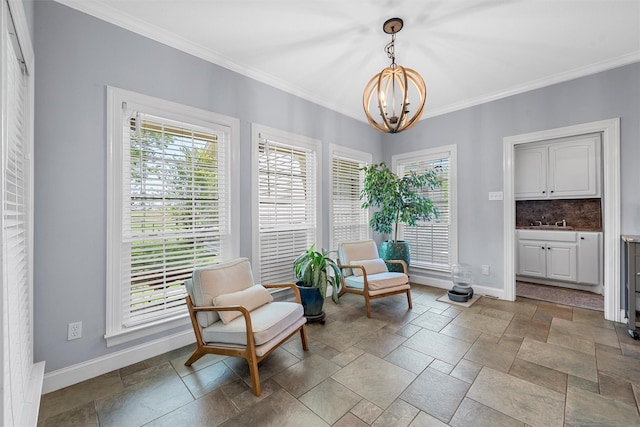 living area with stone tile floors, baseboards, a chandelier, and crown molding