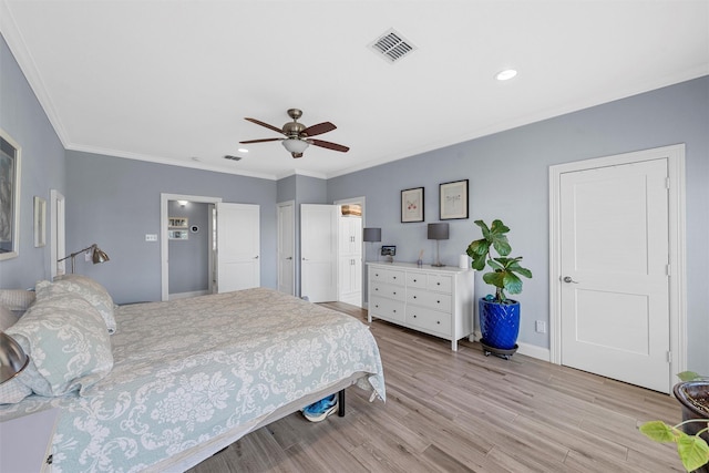 bedroom featuring crown molding, light wood-type flooring, baseboards, visible vents, and recessed lighting