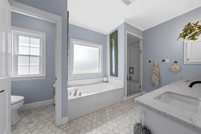 bathroom featuring a whirlpool tub, toilet, a sink, crown molding, and a stall shower