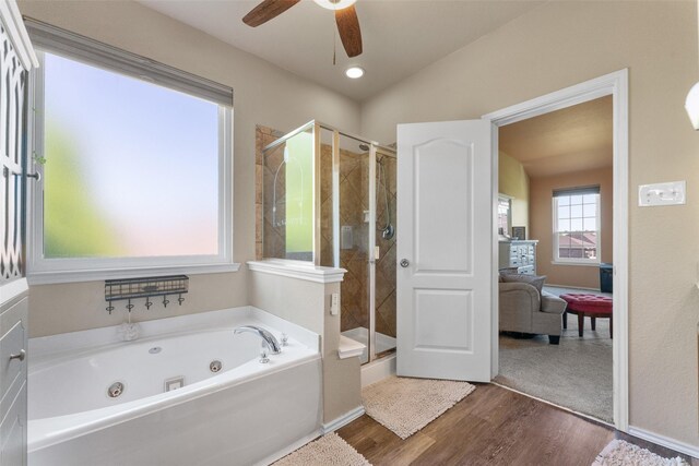 3101 Clear Springs Dr, Forney, TX 75126 - bathroom with a ceiling fan, wood finished floors, a whirlpool tub, a stall shower, and baseboards