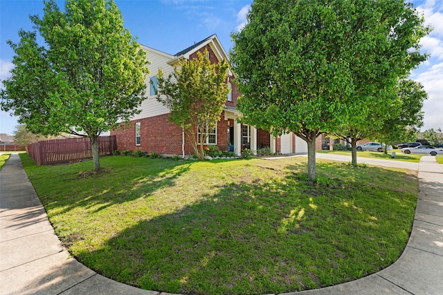 3101 Clear Springs Dr, Forney, TX 75126 - view of front of property with a front yard, fence, brick siding, an attached garage, and driveway