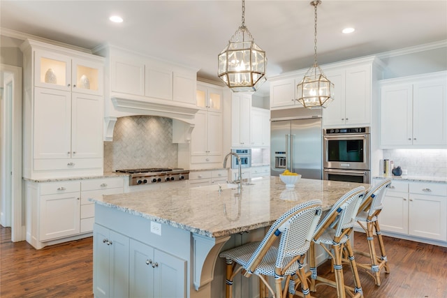 924 Winding Ridge Trl, Southlake, TX 76092 - kitchen featuring decorative backsplash, glass insert cabinets, a sink, appliances with stainless steel finishes, and recessed lighting