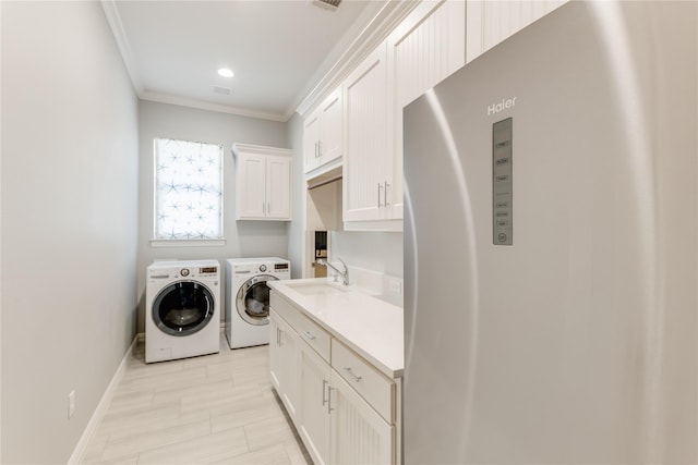 924 Winding Ridge Trl, Southlake, TX 76092 - laundry area with a sink, cabinet space, separate washer and dryer, baseboards, and ornamental molding
