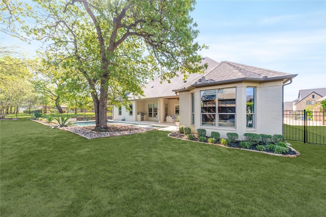 924 Winding Ridge Trl, Southlake, TX 76092 - back of property featuring brick siding, fence, a yard, and a patio area