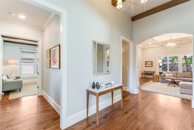 924 Winding Ridge Trl, Southlake, TX 76092 - hall with a chandelier, crown molding, baseboards, arched walkways, and wood finished floors