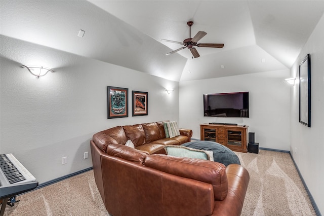 living area featuring carpet flooring, a ceiling fan, and lofted ceiling