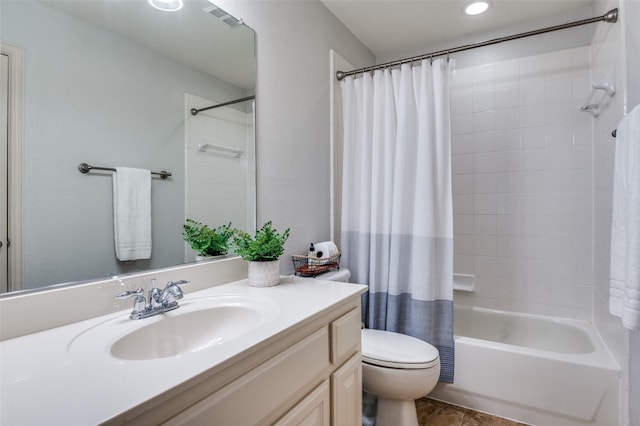 bathroom with toilet, vanity, shower / tub combo with curtain, and visible vents