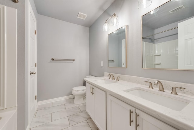 bathroom with visible vents, marble finish floor, and a sink