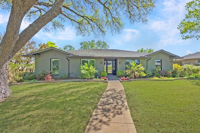 single story home with a front lawn and brick siding