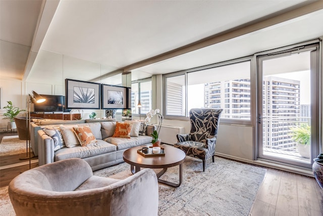 3883 Turtle Creek Blvd Unit 2011, Dallas, TX 75219 - living area with plenty of natural light and wood finished floors