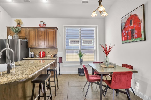 1124 Spanish Moss Dr, Savannah, TX 76227 - dining space featuring light tile patterned floors, visible vents, and baseboards