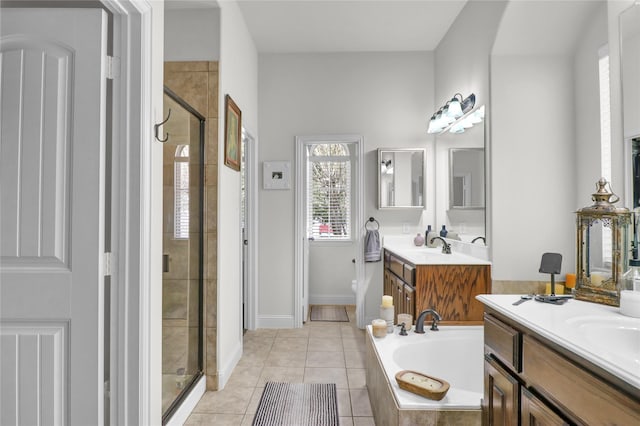 1124 Spanish Moss Dr, Savannah, TX 76227 - bathroom with a bath, toilet, two vanities, a shower stall, and tile patterned floors