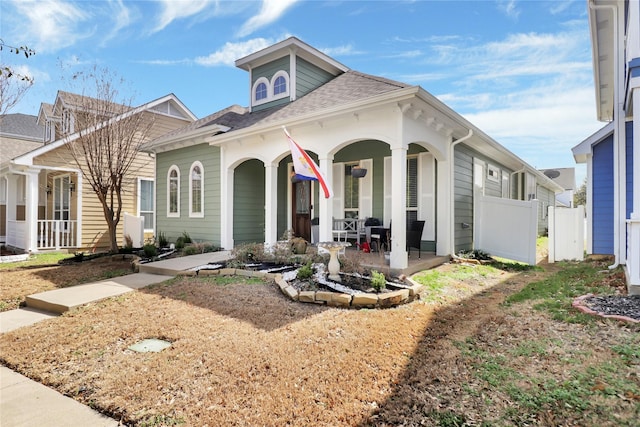 1124 Spanish Moss Dr, Savannah, TX 76227 - view of front of property featuring roof with shingles, covered porch, and fence