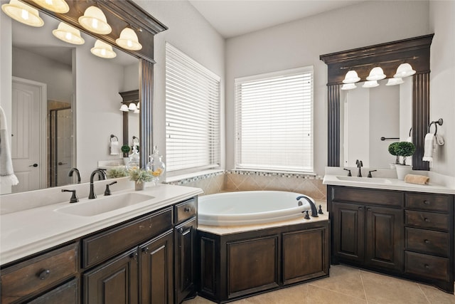 123 Claremont Dr, Ovilla, TX 75154 - bathroom with two vanities, a stall shower, a garden tub, and tile patterned floors