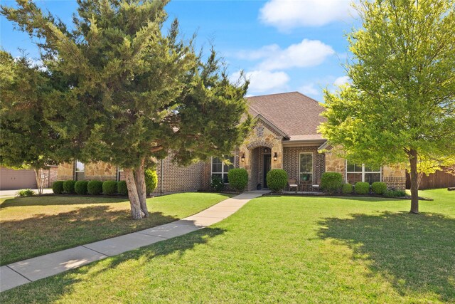 123 Claremont Dr, Ovilla, TX 75154 - view of front facade featuring a front lawn, brick siding, and stone siding