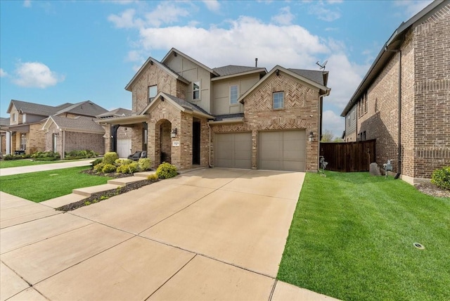2605 High Bluff Dr, Mansfield, TX 76063 - view of front of home featuring fence, a front yard, brick siding, an attached garage, and driveway