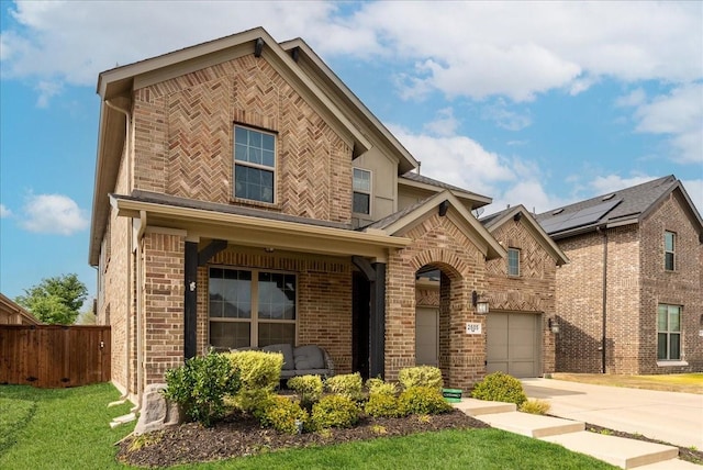 2605 High Bluff Dr, Mansfield, TX 76063 - traditional-style home with a front lawn, fence, brick siding, concrete driveway, and an attached garage