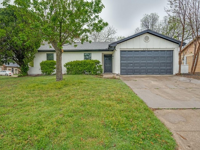 ranch-style house with an attached garage, board and batten siding, concrete driveway, brick siding, and a front lawn