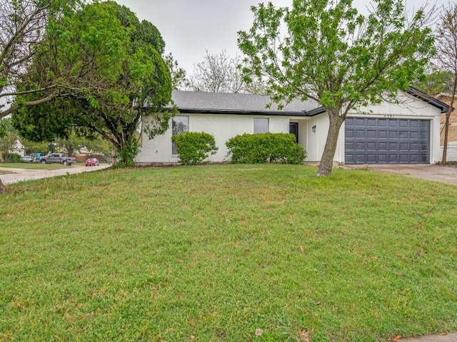 ranch-style home with brick siding, concrete driveway, a garage, and a front yard