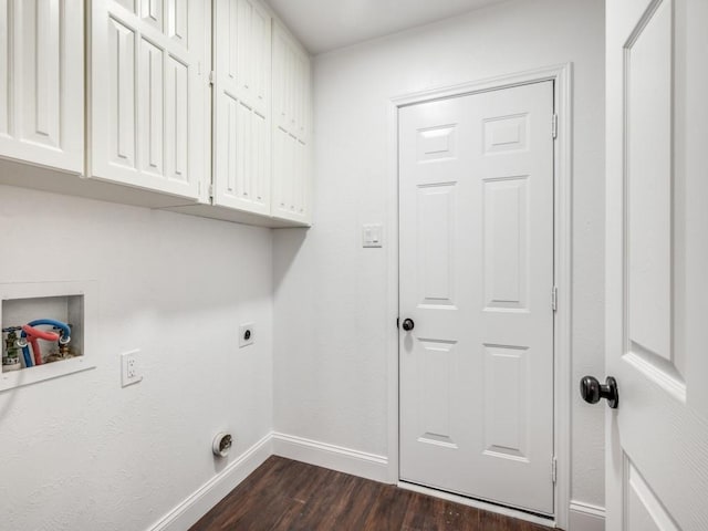 laundry room with baseboards, washer hookup, dark wood finished floors, hookup for an electric dryer, and cabinet space