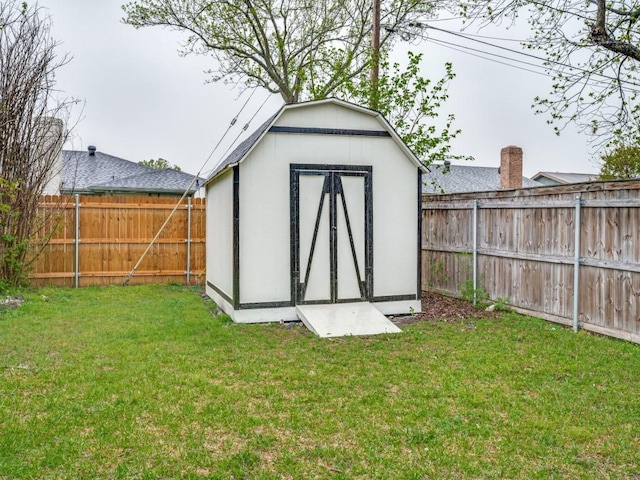 view of shed featuring a fenced backyard
