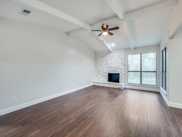 unfurnished living room featuring visible vents, a stone fireplace, a ceiling fan, and dark wood-style floors