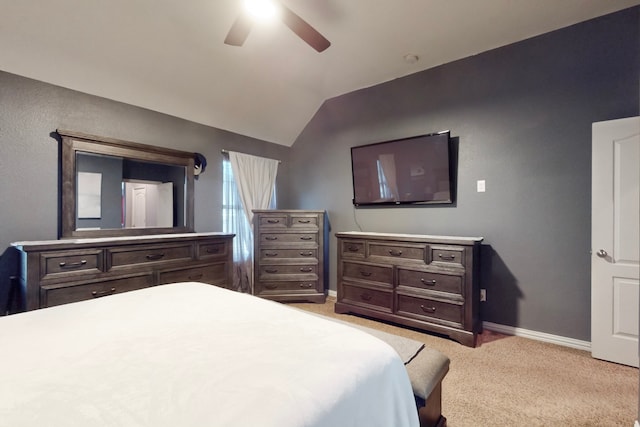 bedroom with light carpet, baseboards, a ceiling fan, and vaulted ceiling
