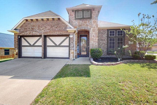 view of front facade with a front yard, stone siding, a garage, and concrete driveway