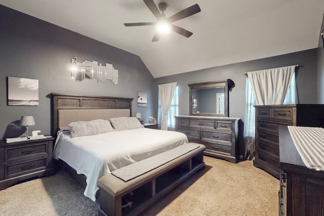 bedroom featuring light carpet, a ceiling fan, and lofted ceiling