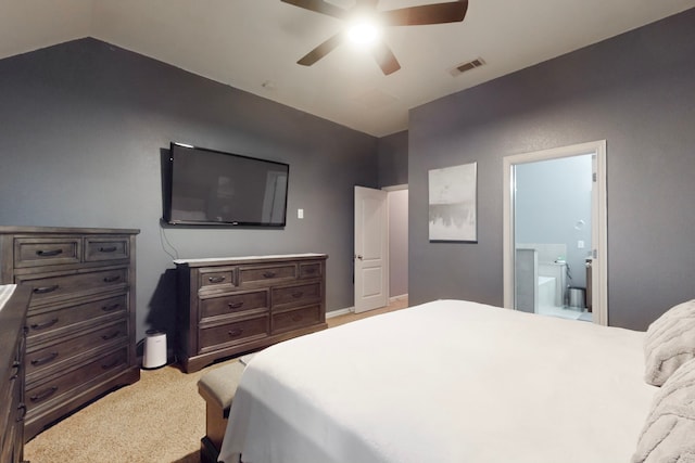 bedroom featuring ensuite bathroom, ceiling fan, vaulted ceiling, visible vents, and carpet floors