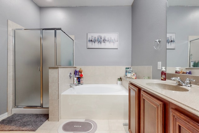 bathroom featuring a shower stall, tile patterned floors, vanity, and a garden tub
